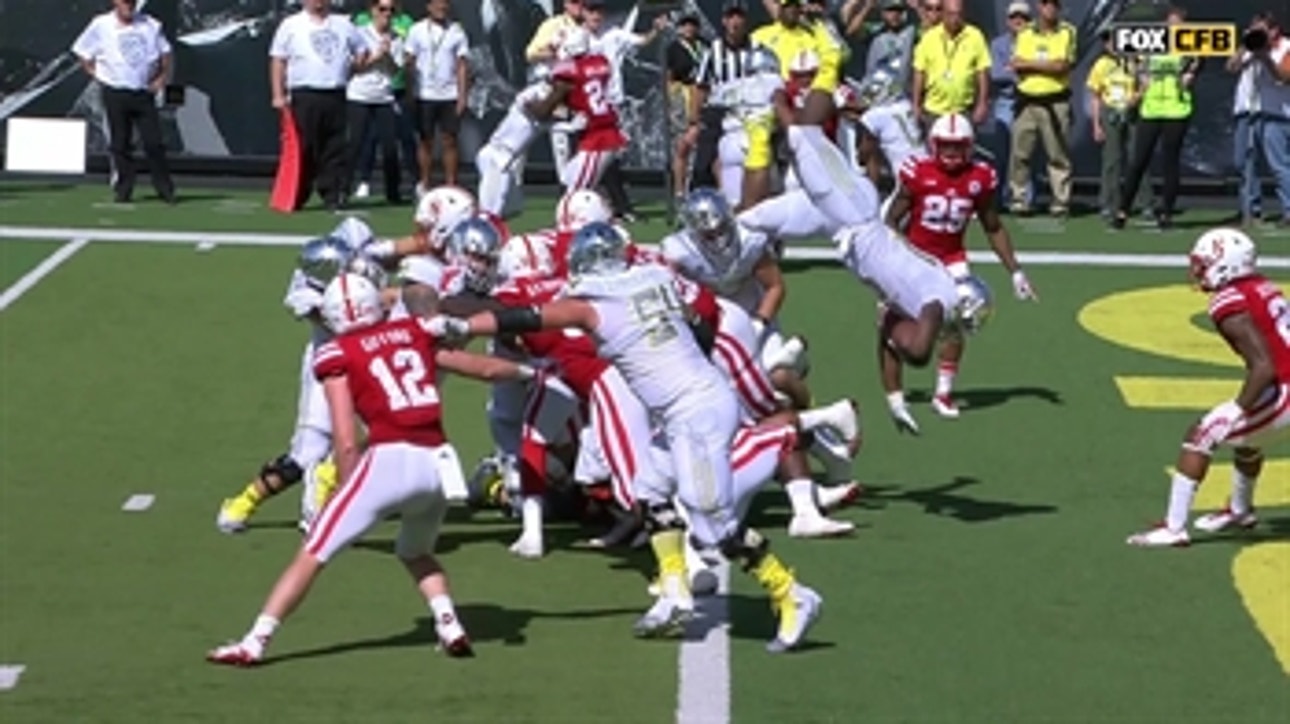 Oregon's Royce Freeman flies over the Nebraska defense for the 1-yard rush touchdown