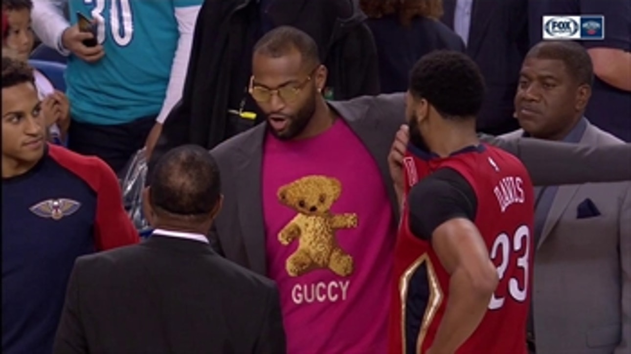 DeMarcus Cousins talks with his former teammates
