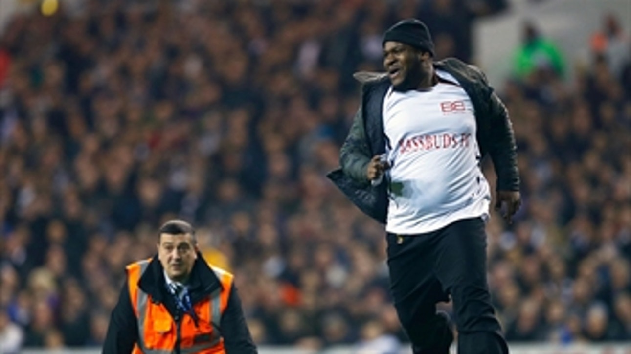 Tottenham pitch invader takes multiple selfies with players