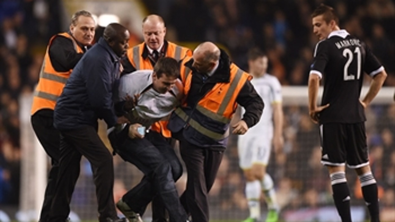 Pitch invader loses shirt, another gets tackled during Tottenham game