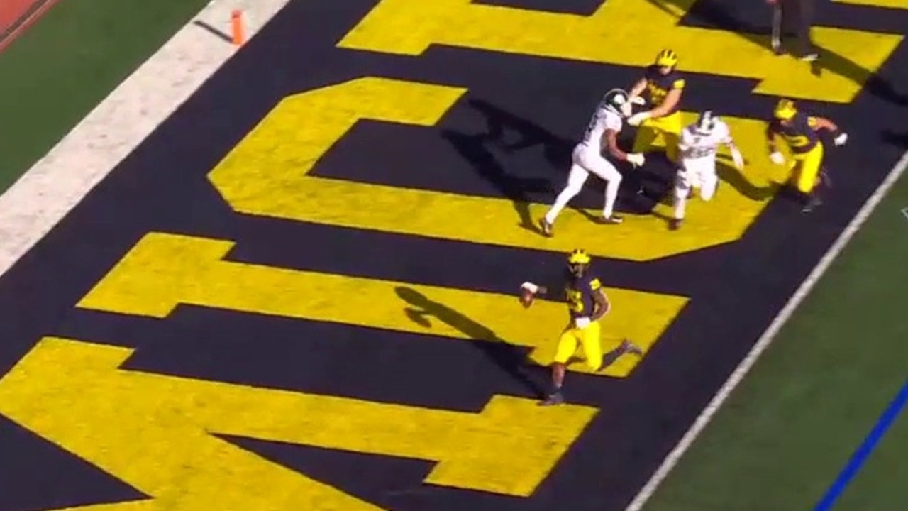 Michigan inches closer to Michigan St with TD run in by Hassan Haskins, 27-24