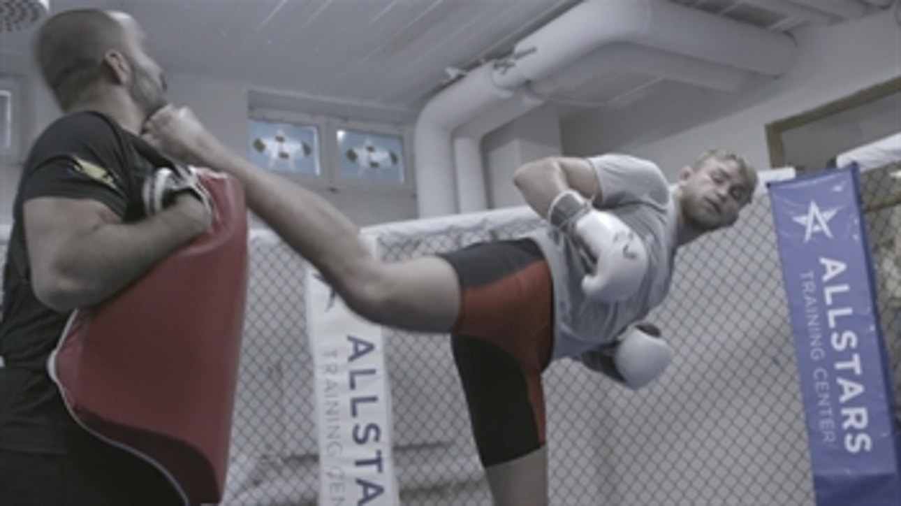 Alexander Gustafsson accidentally kicks his coach in the head while training