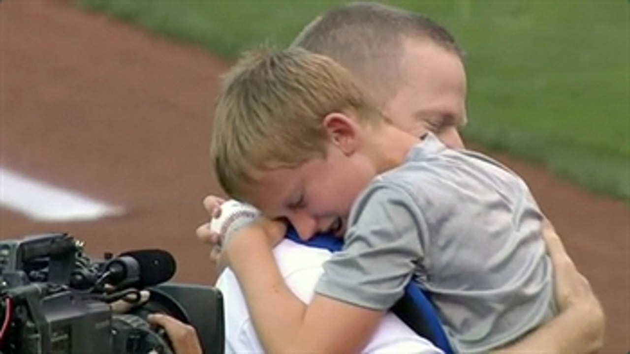 Military dad surprises son after first pitch