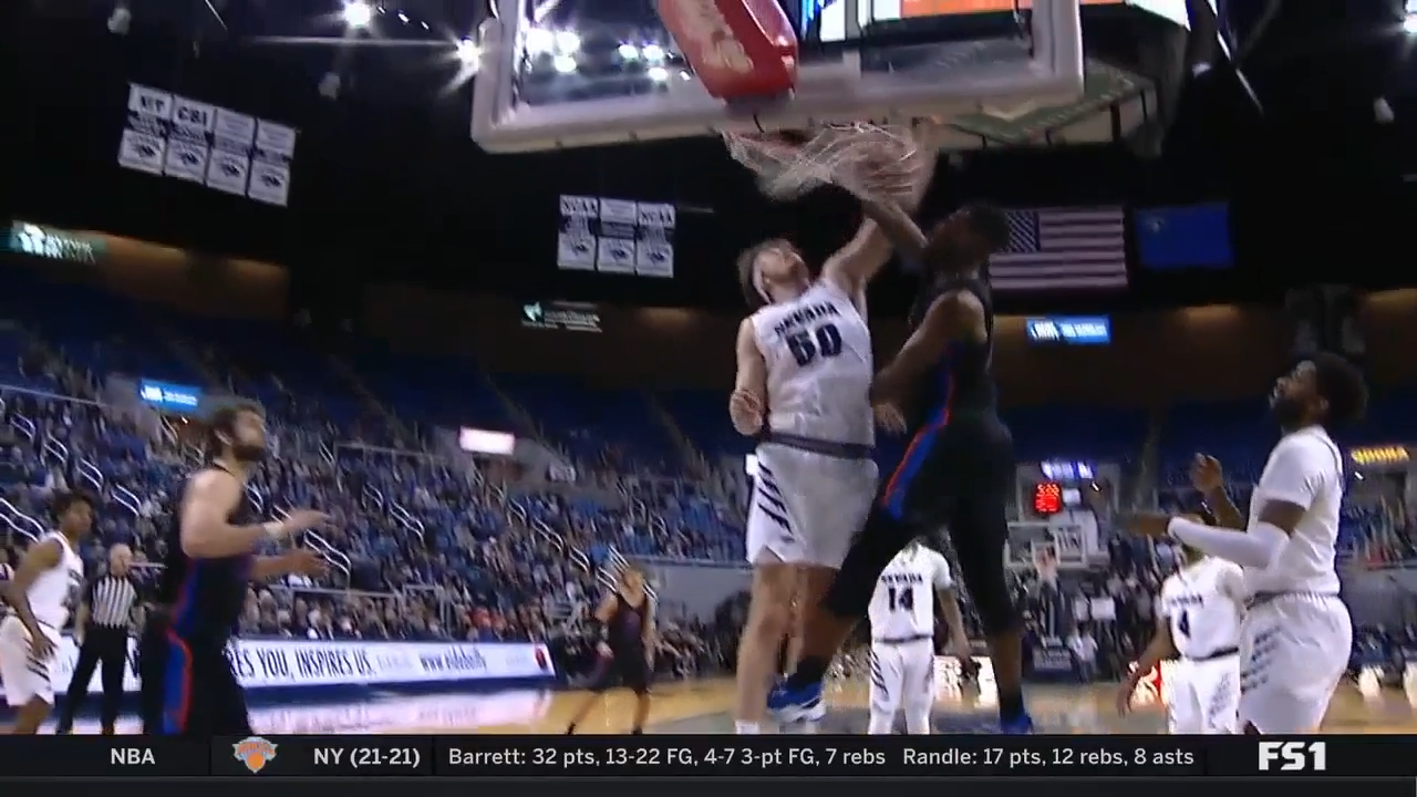 Boise State's Emmanuel Akot throws down an emphatic dunk on Nevada