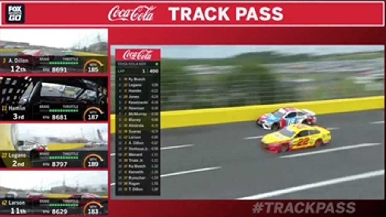 Joey Logano takes the lead from Kyle Busch on the opening lap