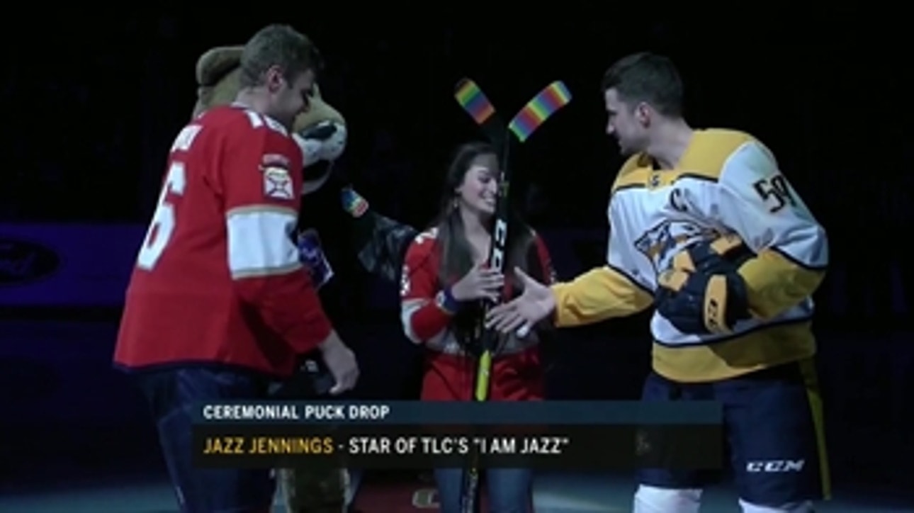Panthers captain Aleksander Barkov and Predators captain Roman Josi exchange sticks with Jazz Jennings for Pride Night