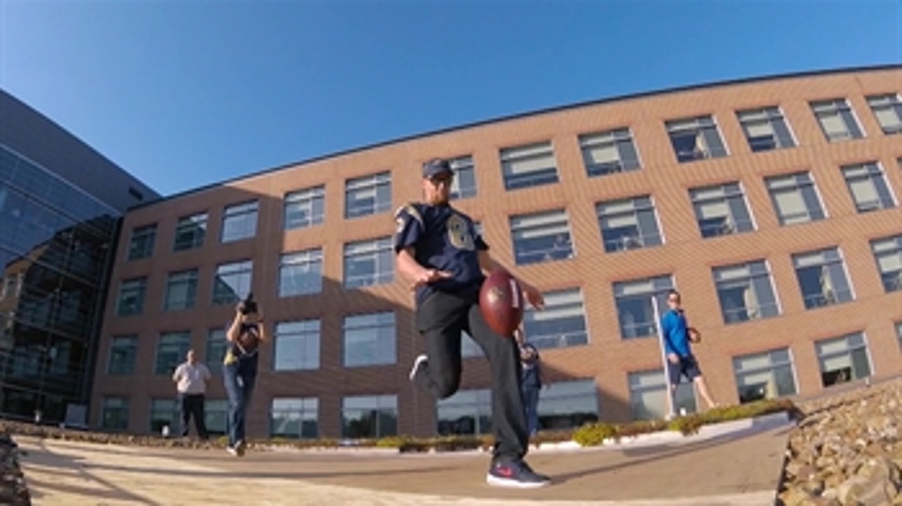 Hekker punts footballs off a hospital roof for charity