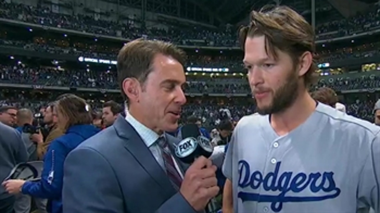 Clayton Kershaw talks with Tom Verducci after closing down Game 7 of the NLCS