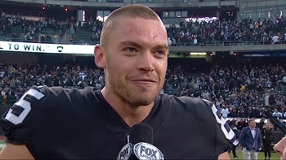 Derek Carrier talks with Shannon Spake after the Raiders' narrow victory over the Steelers