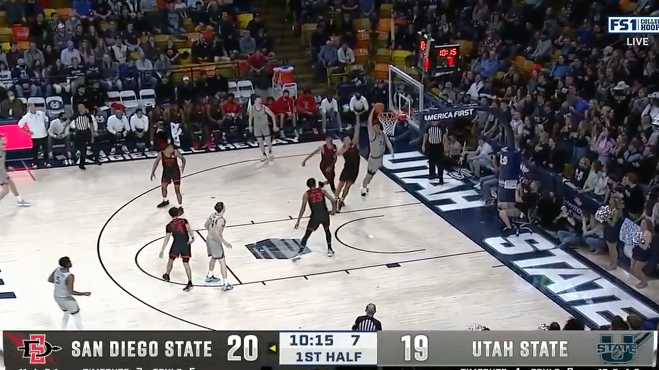 Trevin Dorius throws down a slam dunk to give Utah State the lead, 21-20.