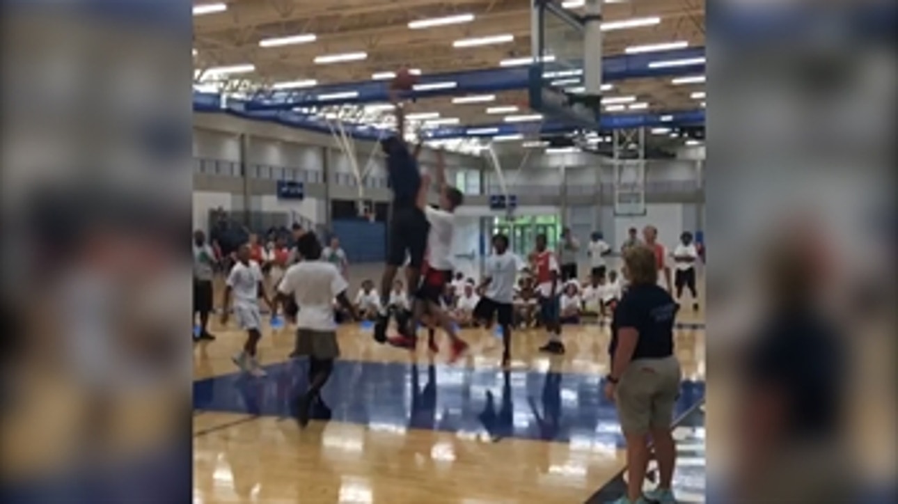 NBA Rookie of the Year Karl-Anthony Towns throws down monster dunk over young camper