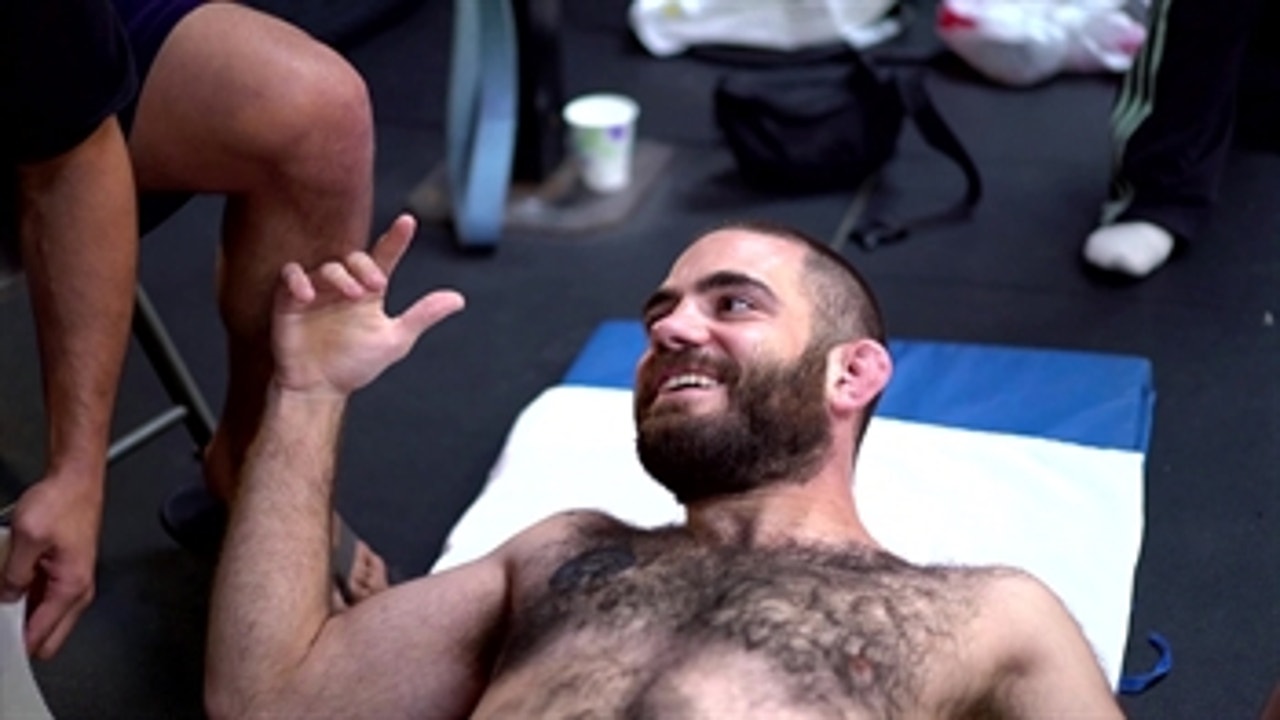 Tom Gallicchio gets his chest waxed to help his teammate Sam Alvey