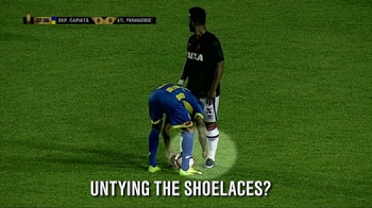 Player unties opponent's shoelaces during a match