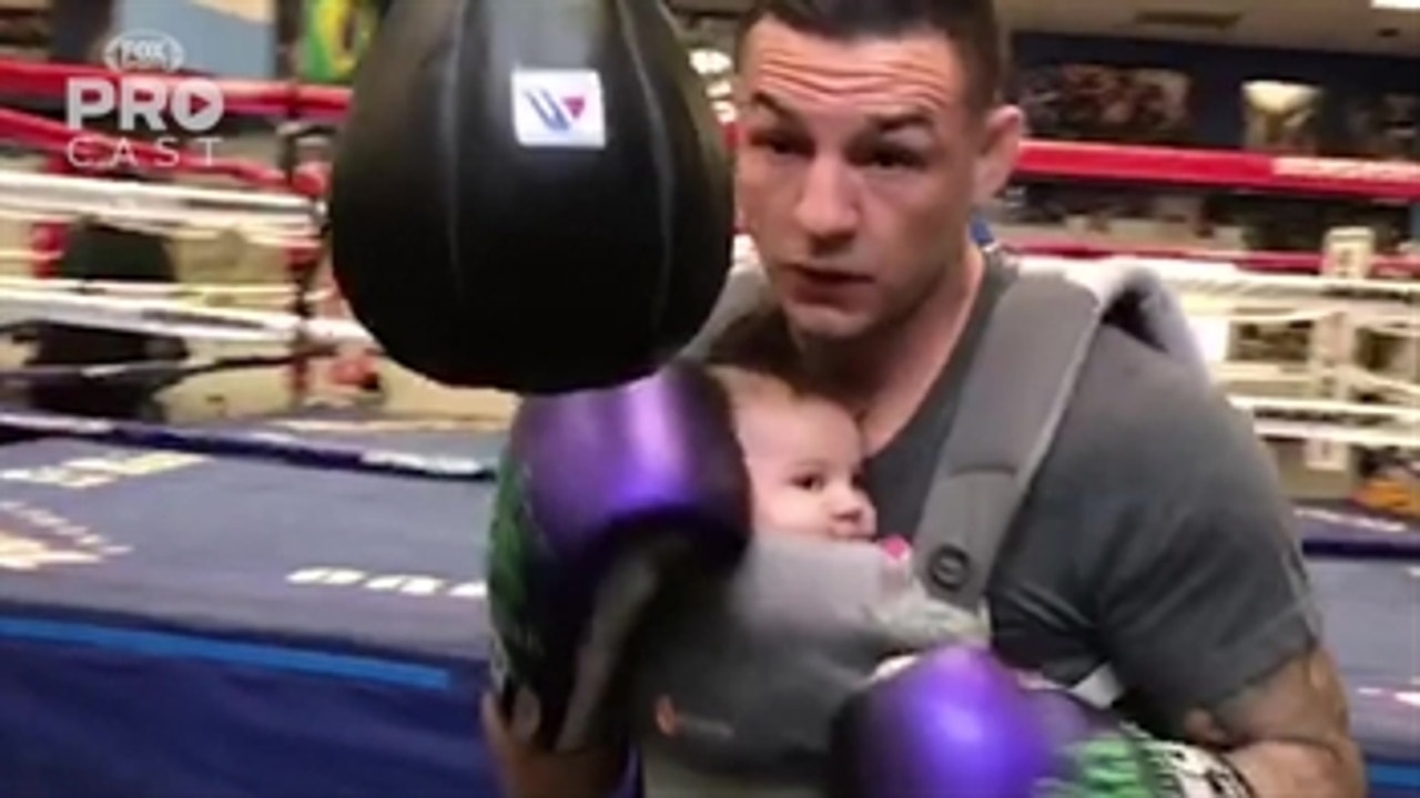 Cub Swanson gets in a workout with his infant strapped to his chest