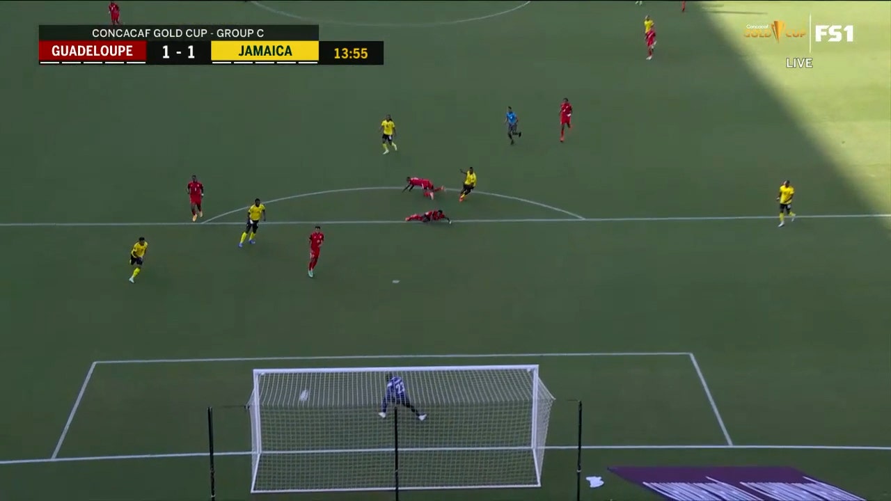 Cory Burke scores from outside the box to tie it up for Jamaica against Guadeloupe, 1-1