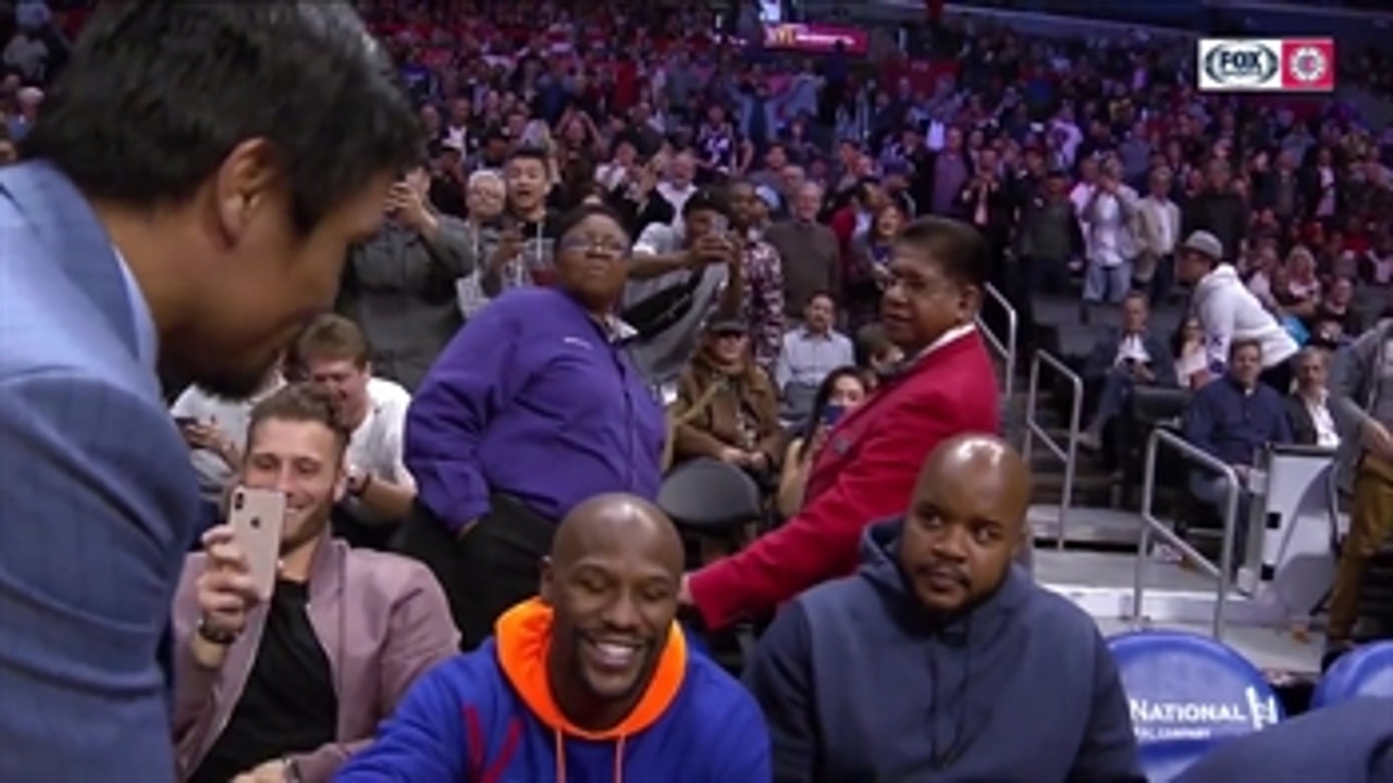 Manny Pacquiao greets Floyd Mayweather, dap each other at Clippers game