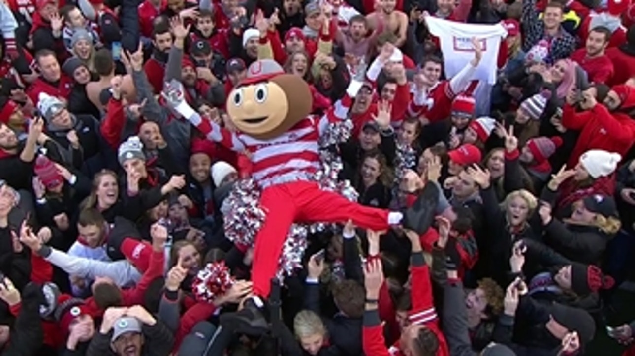 Ohio State fans rush the field and Brutus the Buckeye crowd surfs after win vs. Michigan