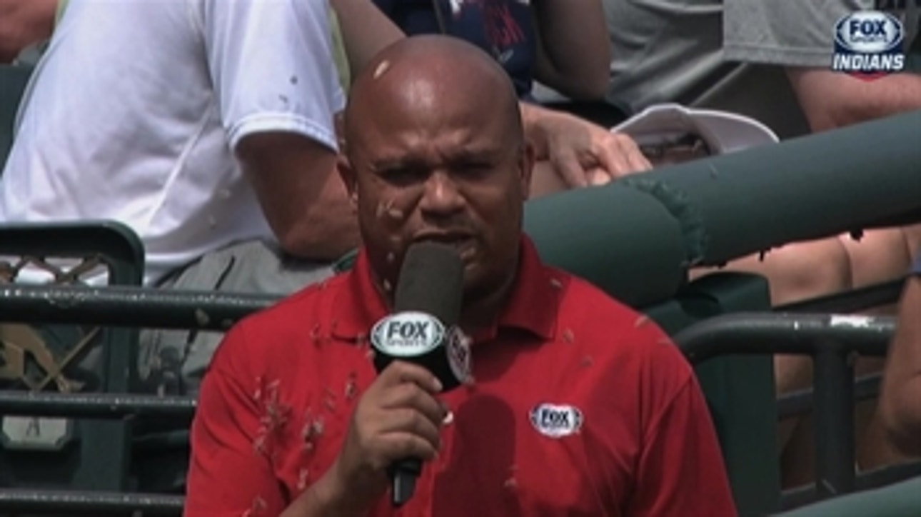 Andre Knott gets pelted by sunflower seeds from Indians dugout