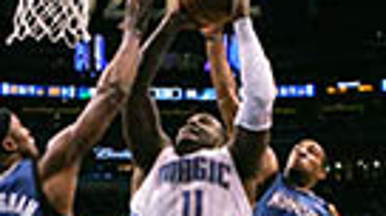 Davis leads Magic rally past Wolves
