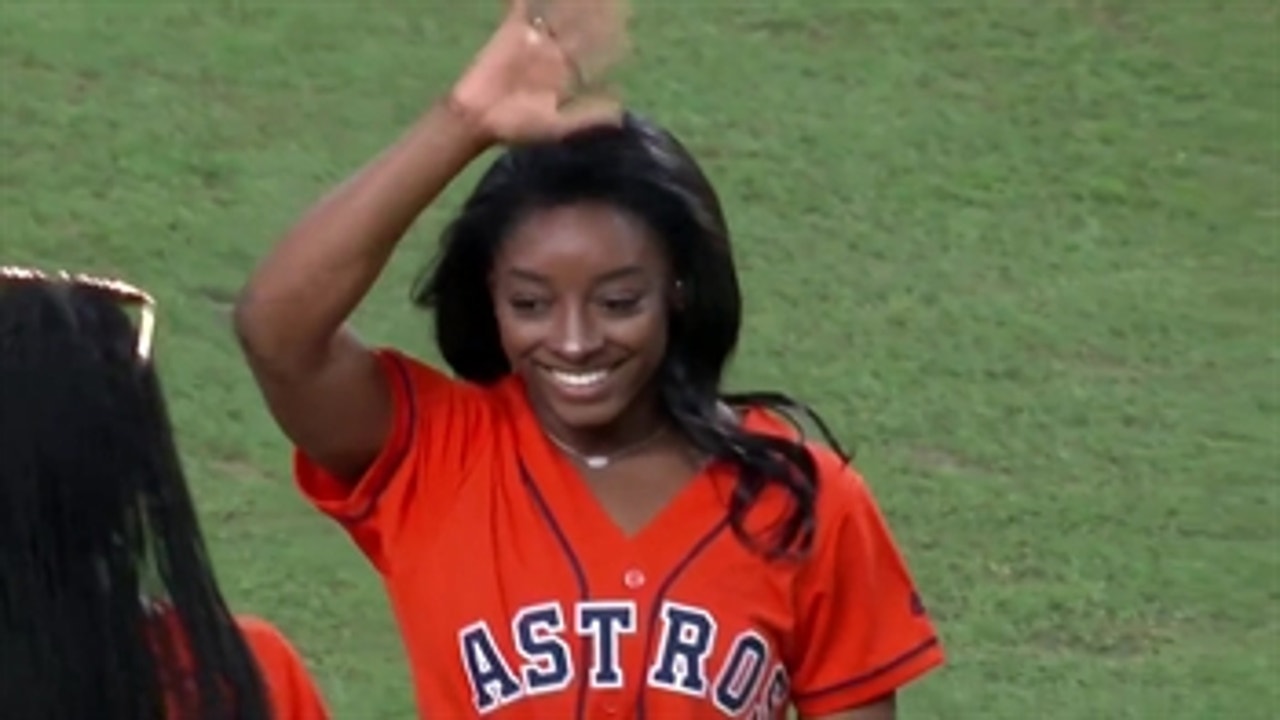 Simone Biles throws out the first pitch of Game 2 of World Series