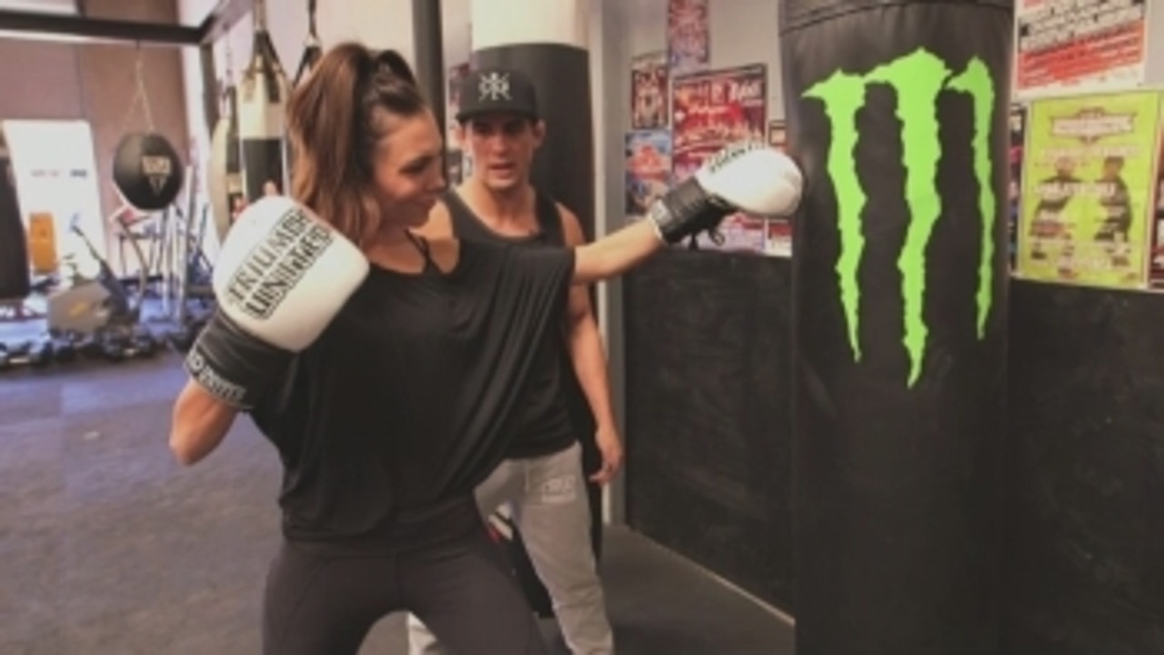 Dominick Cruz teaches Brie Thiele how to fight like a champion