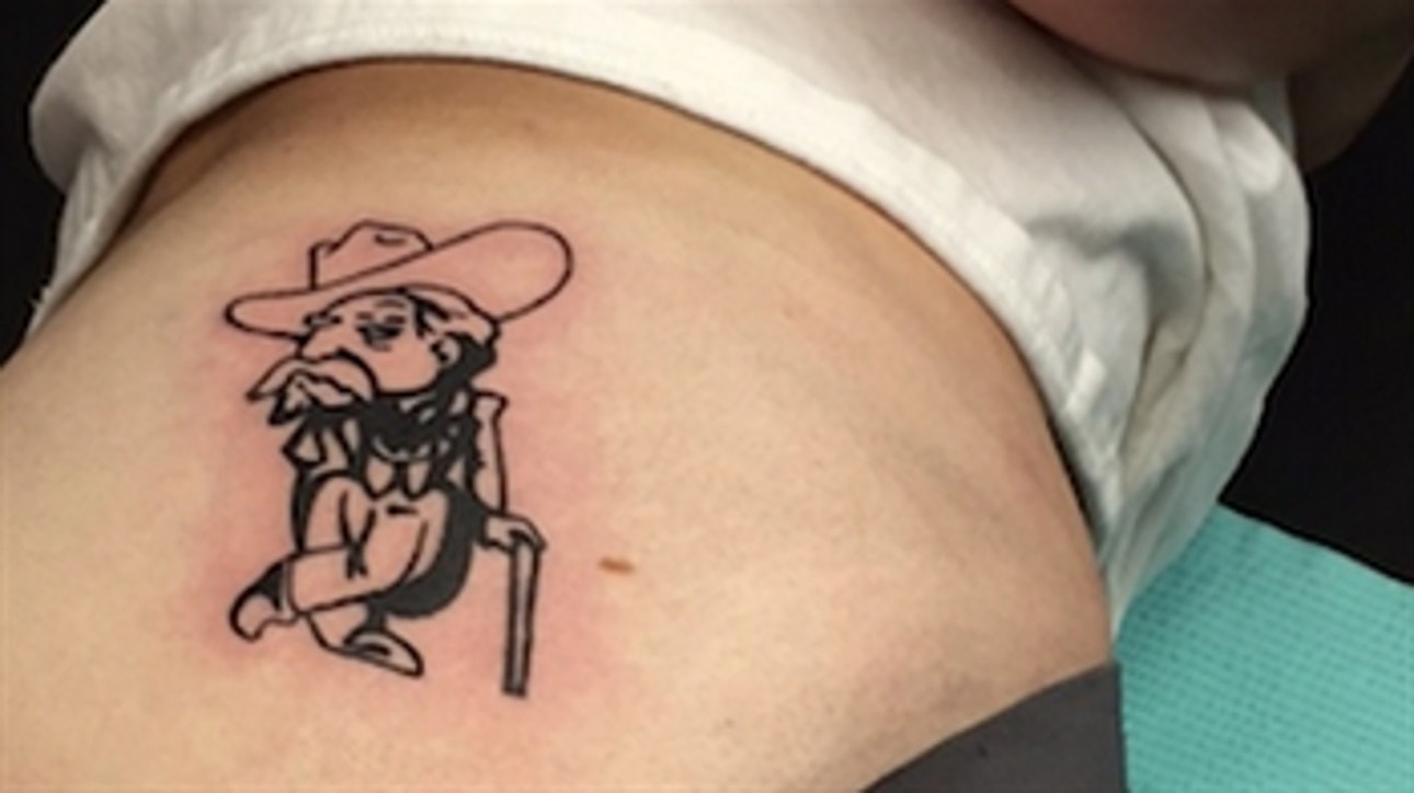 Alabama fan loses bet, gets Ole Miss tattoo