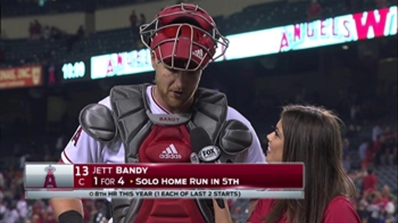 Jett Bandy (1-for-4, HR) chats with Alex Curry after 6-4 win over Mariners