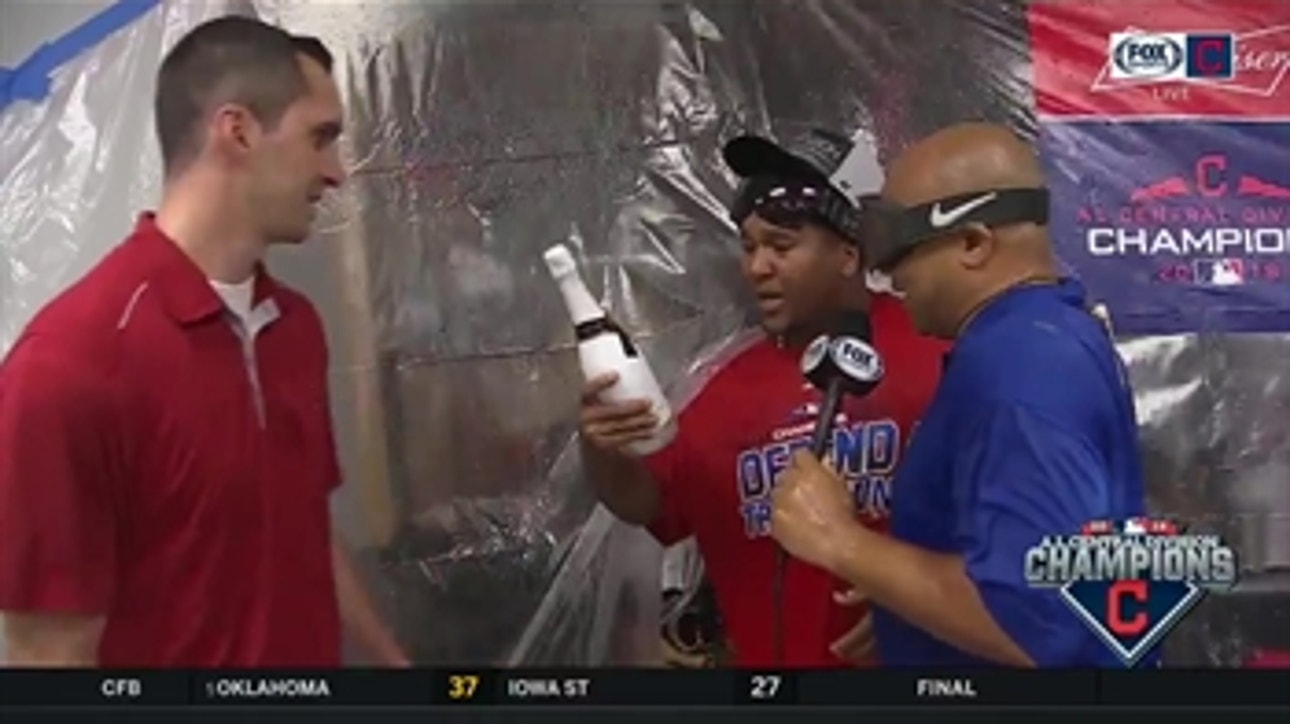 Jose Ramirez gets a little distracted by Indians' clubhouse celebration during his interview