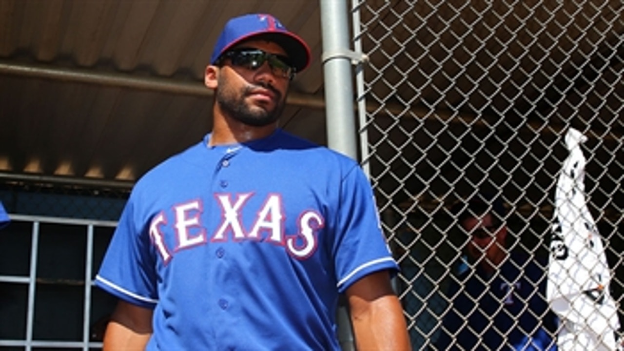 Russell Wilson practices with Rangers, hits home run