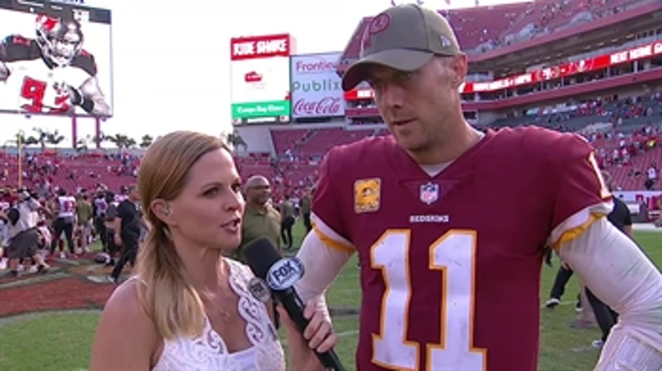 Alex Smith talks to Shannon Spake after the Redskins' win over the Buccaneers