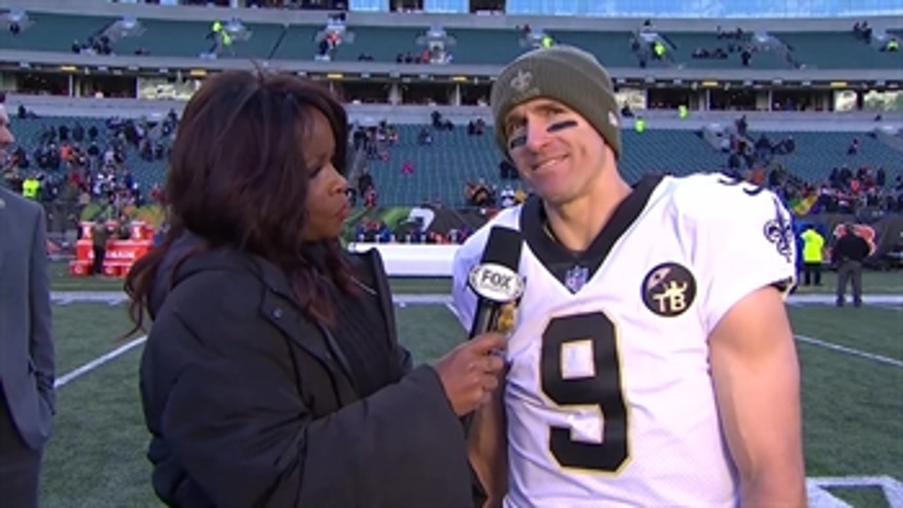 Drew Brees talks with Pam Oliver after getting his 150th win as a starting QB