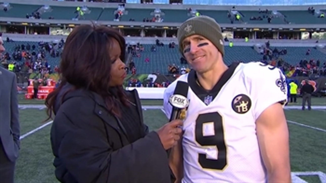 Drew Brees talks with Pam Oliver after getting his 150th win as a starting QB