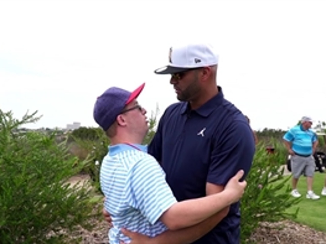 St. Louis Cardinals Albert Pujols gives his six-year-old son A.J.