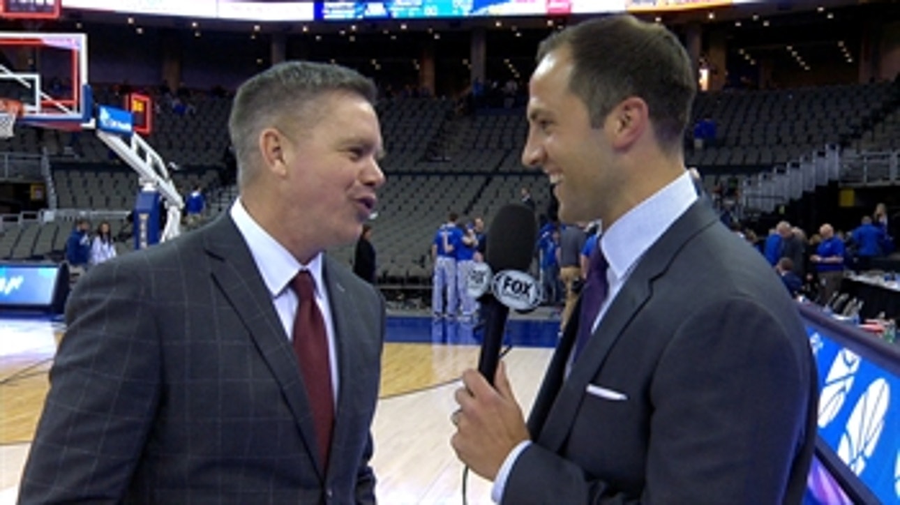 Chris Holtmann talks with Nick Bahe after Ohio State's comeback win over Creighton