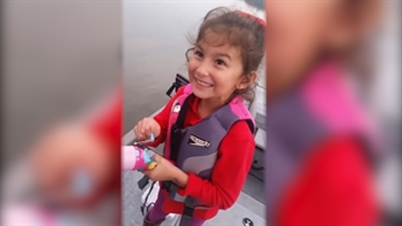 Little girl catches big fish with Barbie fishing pole