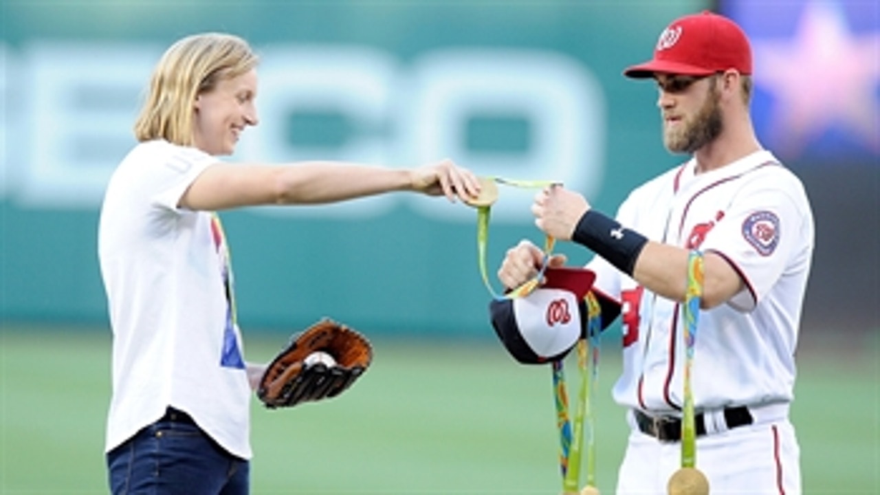 Katie Ledecky tosses first pitch with help from Bryce Harper