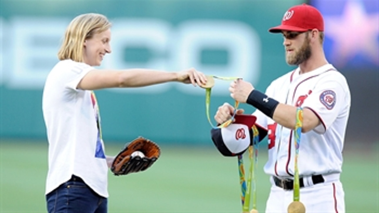 Katie Ledecky tosses first pitch with help from Bryce Harper