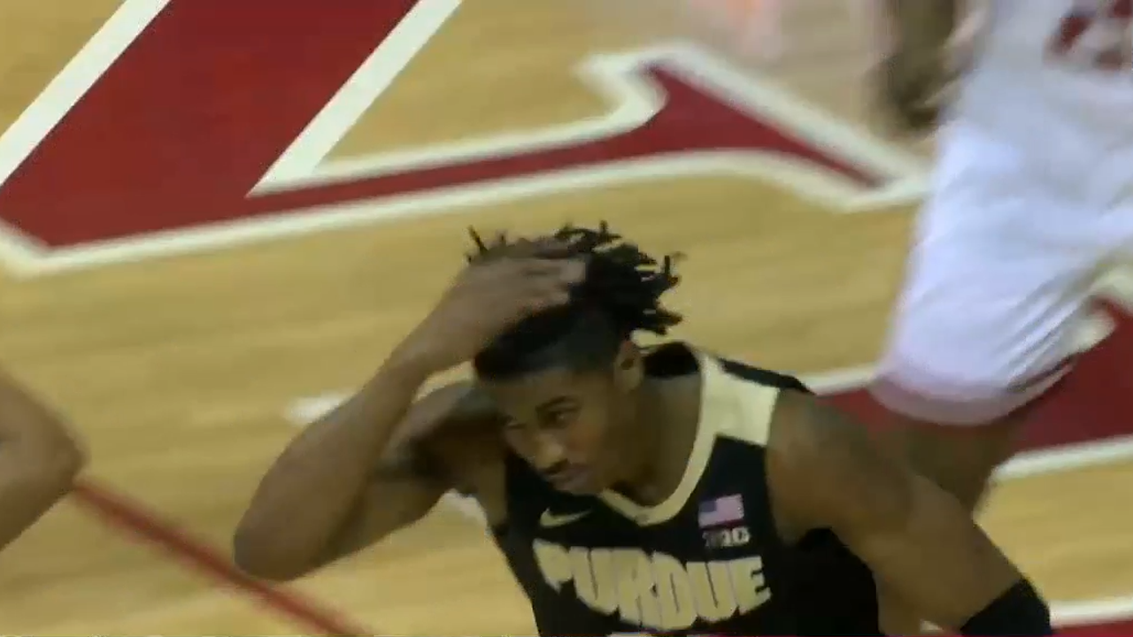 Purdue's Jaden Ivey drives hard to the basket and finishes a tomahawk dunk on Indiana