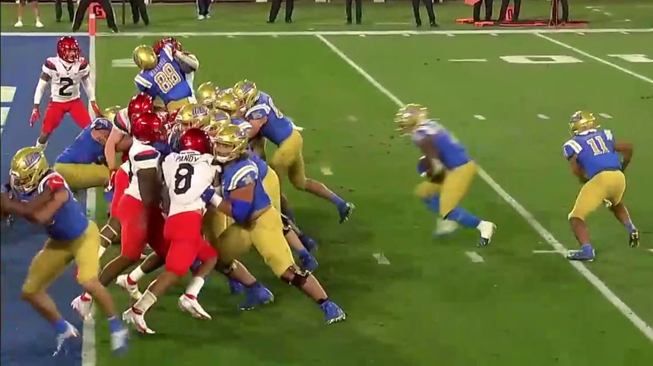 UCLA's Demetric Felton dives into the end zone to give Bruins a 17-7 lead over Arizona
