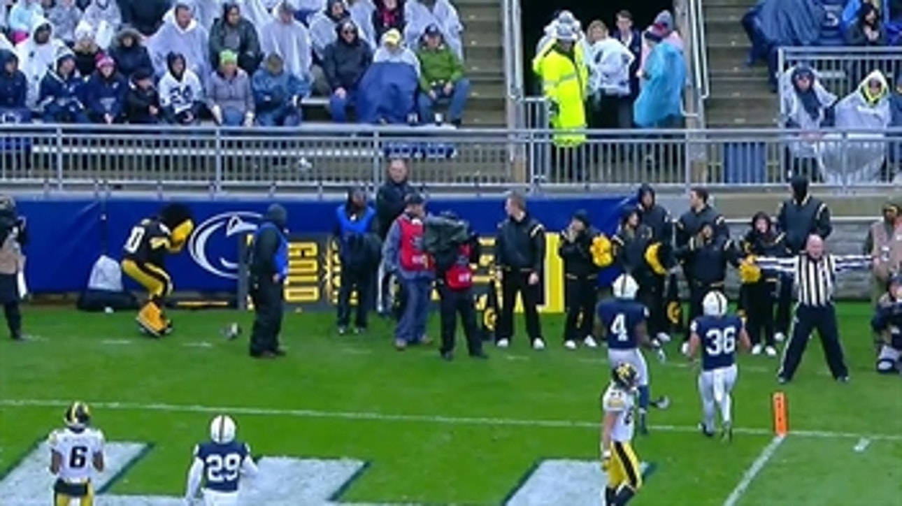 The Iowa mascot took a shot from an errant pass on the sidelines