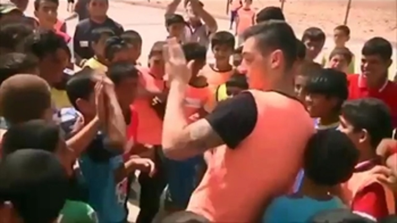 Mesut Ozil plays soccer with kids in refugee camp in Jordan