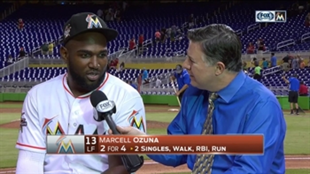 Marcell Ozuna speaks with Craig Minervini after his walk-off single