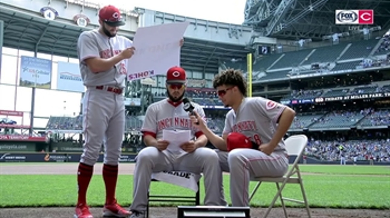 Eugenio Suarez has some fun with the microphone and reads off ads