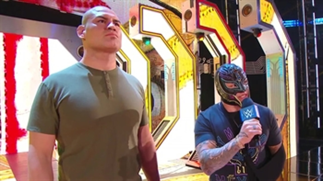 Cain Velasquez and Rey Mysterio confront Brock Lesnar