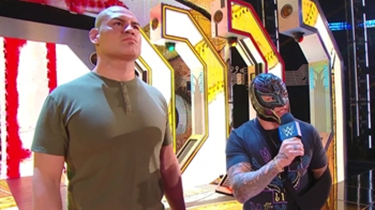 Cain Velasquez and Rey Mysterio confront Brock Lesnar