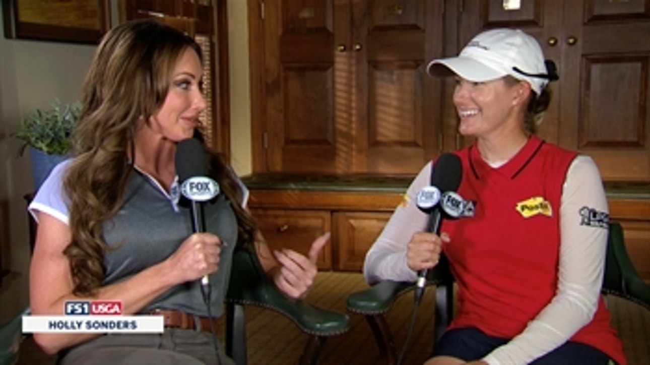 Sarah Jane Smith talks with Holly Sonders after retaking the lead with a strong second round
