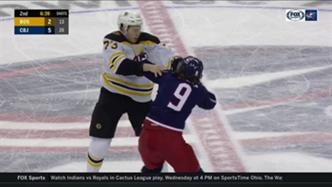 Artemi Panarin and Charlie McAvoy drop their gloves and duke it out