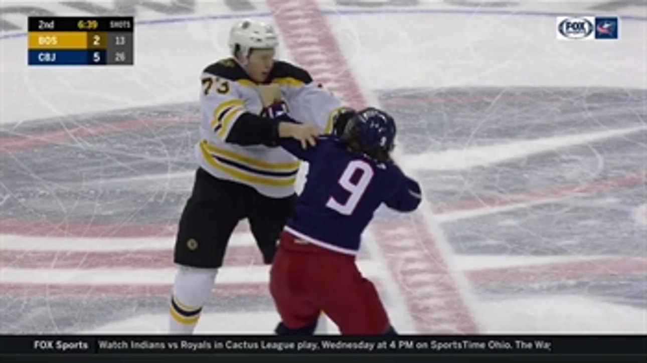 Artemi Panarin and Charlie McAvoy drop their gloves and duke it out
