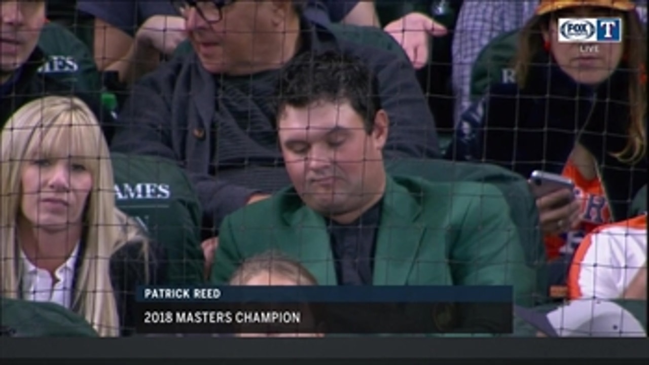 Patrick Reed wearing his Masters green jacket at Rangers-Astros game
