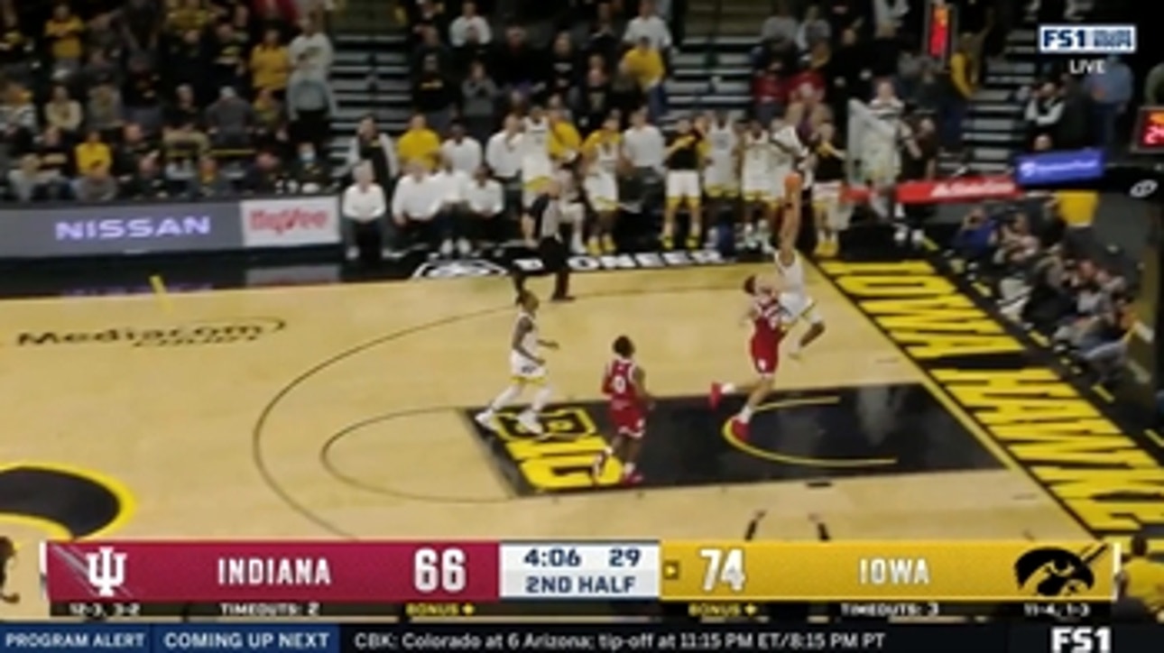 Kris Murray comes up with the steal and finishes it with a one-handed dunk to increase Iowa's lead